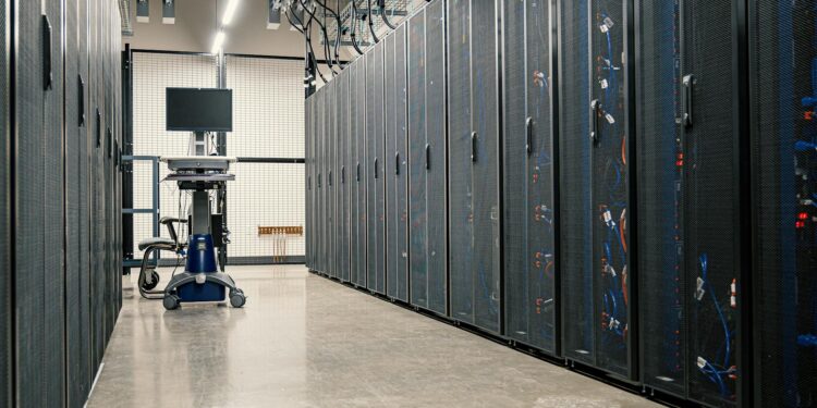 A digital rendering of a modern data center filled with AI server racks and circuitry.