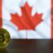 A graphic showing a digital currency symbol with a blurred Canadian flag in the background.