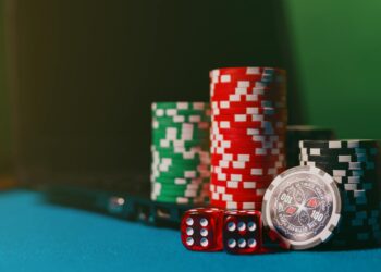 Gavel and scales of justice against a backdrop of gambling chips and online betting logos.