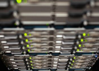 Data center with high-performance servers, symbolizing AI compute expansion.