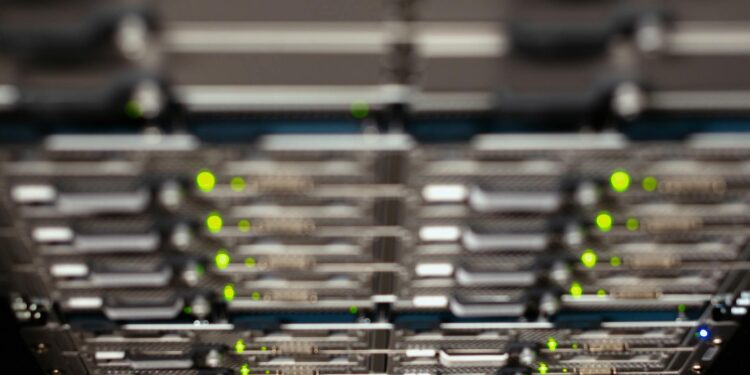 Data center with high-performance servers, symbolizing AI compute expansion.