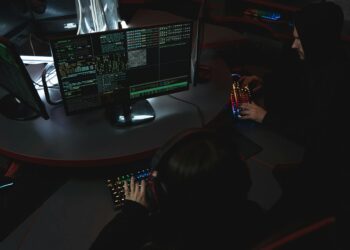 Security researchers analyzing code on a computer screen, focusing on vulnerabilities.