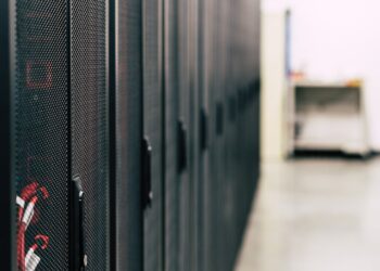 Technicians inspect advanced AI computing servers in a high-tech facility in China.