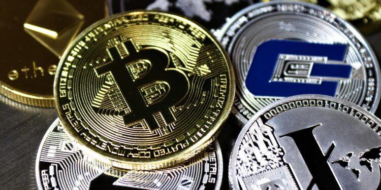 Graphic showing a crypto wallet and digital coins with a red alert symbol, indicating a security breach.