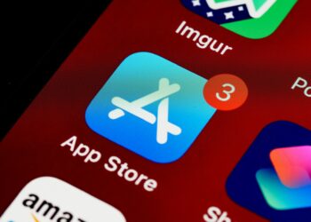 A smartphone screen displaying Bitchat app being removed from an app store interface.