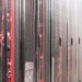 Two engineers working on advanced TPU servers with Google and Broadcom branding visible.