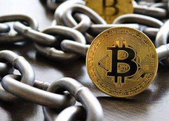 A digital representation of cryptocurrencies linked by chains, symbolizing TRON's cross-chain capabilities.