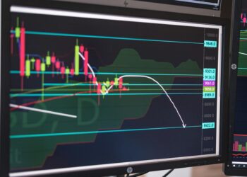 Multiple screens displaying financial charts with crypto symbols, reflecting market reactions.