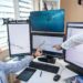 Traders analyzing charts on a computer screen with Ethereum symbols and trading data.