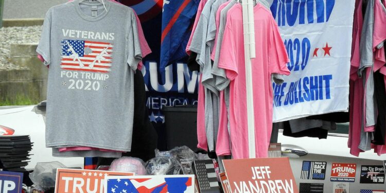 Donald Trump speaking at a podium with U.S. flags, warning against China's arms support to Iran.