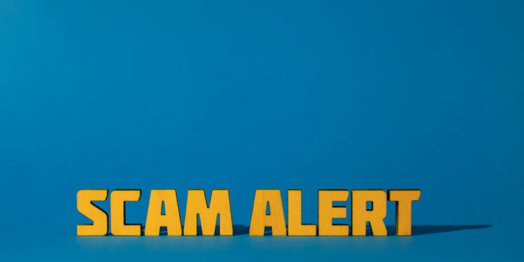 Graphic warning icon with a digital lock and phishing alert in a crypto context.