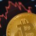 A Bitcoin coin stands out against a fluctuating stock market graph background.