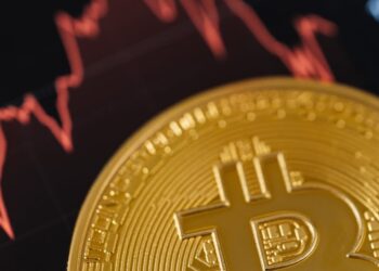 Graph showing Bitcoin price fluctuations with a backdrop of financial news headlines.