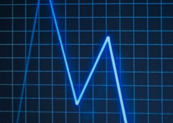 A digital illustration of a declining WLD token graph amid inflation risk symbols.