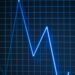 A digital illustration of a declining WLD token graph amid inflation risk symbols.