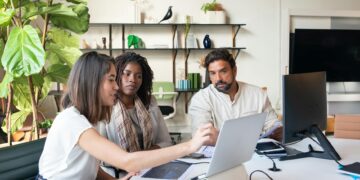 Claude AI team discussing election safeguards and regulatory compliance in a digital workspace.