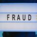 Law enforcement agents examining cryptocurrency hardware linked to a major fraud investigation.