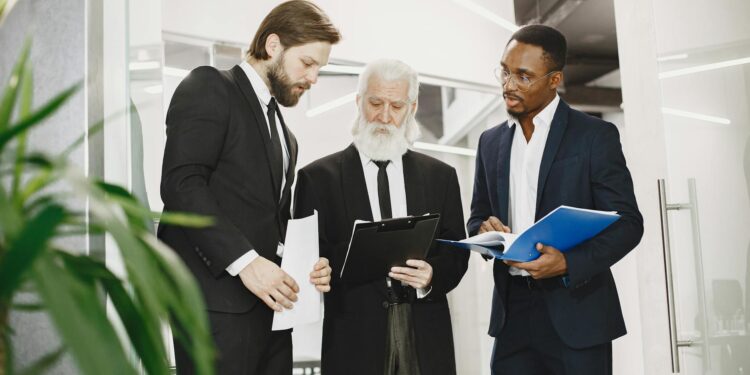 Business executives discussing Bitcoin growth strategy in a modern office setting.