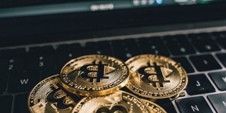 A close-up of a quantum computer with Bitcoin symbols around it, representing cryptographic threats.