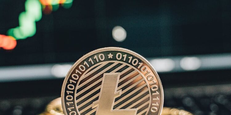 Cryptocurrency coins and financial graphs with stablecoin symbols on a blurred background.