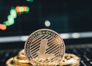 Bitcoin coins on a financial graph background, symbolizing crypto investment trends.