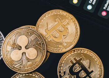 A digital wallet with cryptocurrency symbols, highlighting cyber theft and laundering activities.