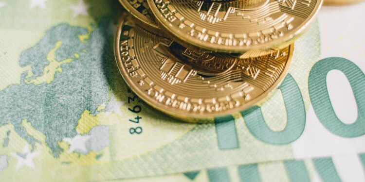 Euro banknotes and cryptocurrency coins on a financial report background, symbolizing regulation.