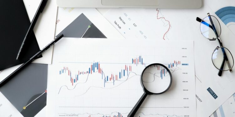 A gavel rests on financial documents, symbolizing regulatory actions in prediction markets.