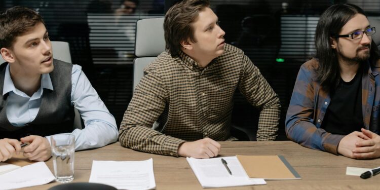 Ripple and Kyobo Life representatives discuss blockchain bond project at a conference table.