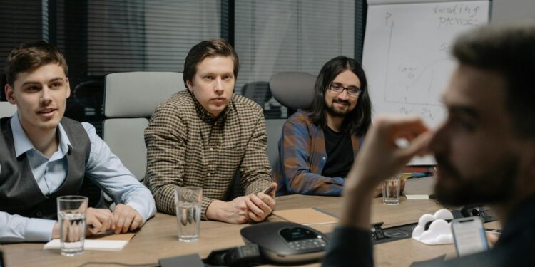 Amazon and Anthropic teams discussing AI advancements in a modern conference room.