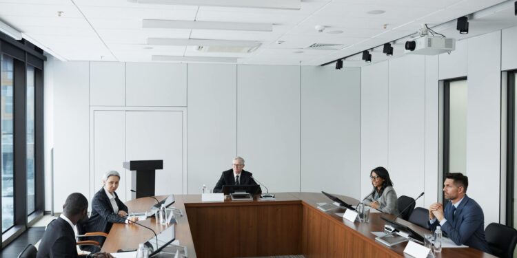 KBank executives discussing blockchain remittances with Ripple representatives in a conference room.