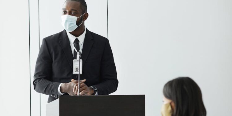 Texas Attorney General Ken Paxton speaking at a podium, discussing financial regulations.