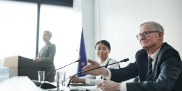 A government official gestures while presenting a ban on iGaming advertising in Ontario.