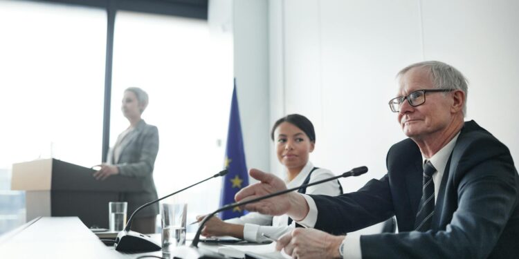 A government official gestures while presenting a ban on iGaming advertising in Ontario.