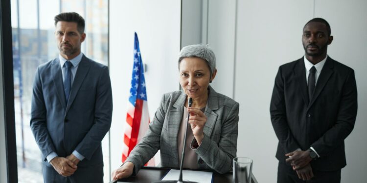 Government officials discussing cryptocurrency regulations in a conference room.