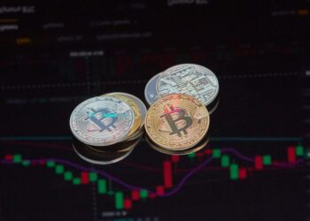 MicroStrategy's logo with a backdrop of Bitcoin symbols and fluctuating market charts.