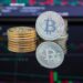 A gavel and cryptocurrency coins symbolizing regulation in financial markets.