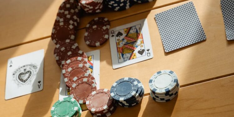 Player card with a QR code displayed on a smartphone beside gambling chips and cash.