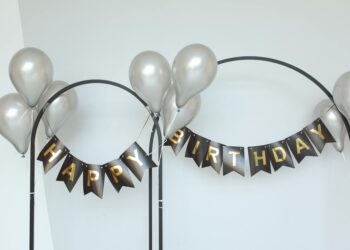 MEXC team members celebrate with banners and balloons during the anniversary event.