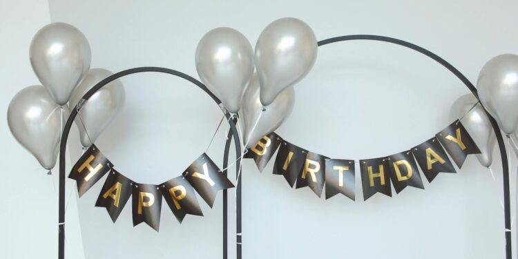 MEXC team members celebrate with banners and balloons during the anniversary event.