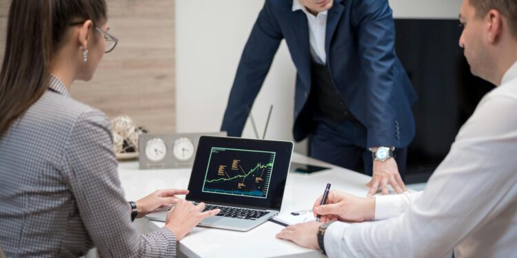 Tether executives discuss Bitcoin merger strategy at a financial conference.