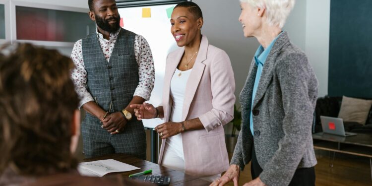 Group of investors discussing blockchain strategies in a modern office setting.
