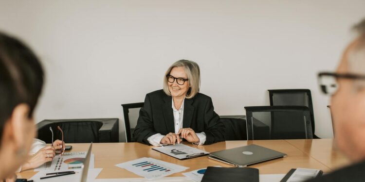 A financial expert discusses stablecoin regulations at a conference table.