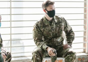 U.S. Army sergeant at a court hearing discussing insider trading allegations.