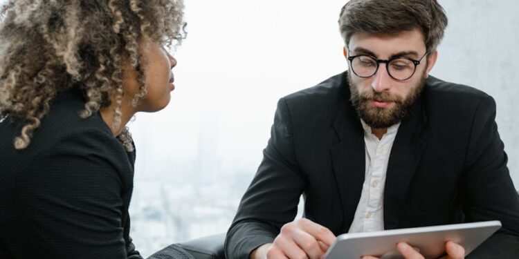 Banking professionals discussing blockchain technology in a modern financial office setting.