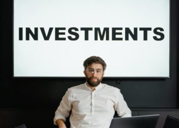 A financial professional discusses investment strategies at a tech conference.