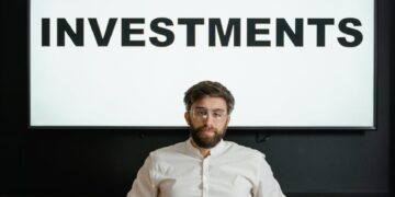 A financial professional discusses investment strategies at a tech conference.