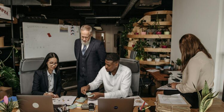 Financial professionals discussing stablecoin service in a modern office setting.