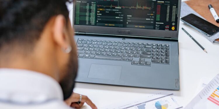 State employees analyze data on financial regulations and prediction markets in a meeting room.