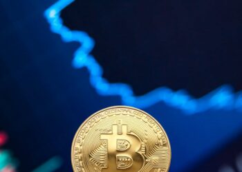 SEC Chair Paul Atkins speaking at a conference, surrounded by Bitcoin symbols and financial charts.
